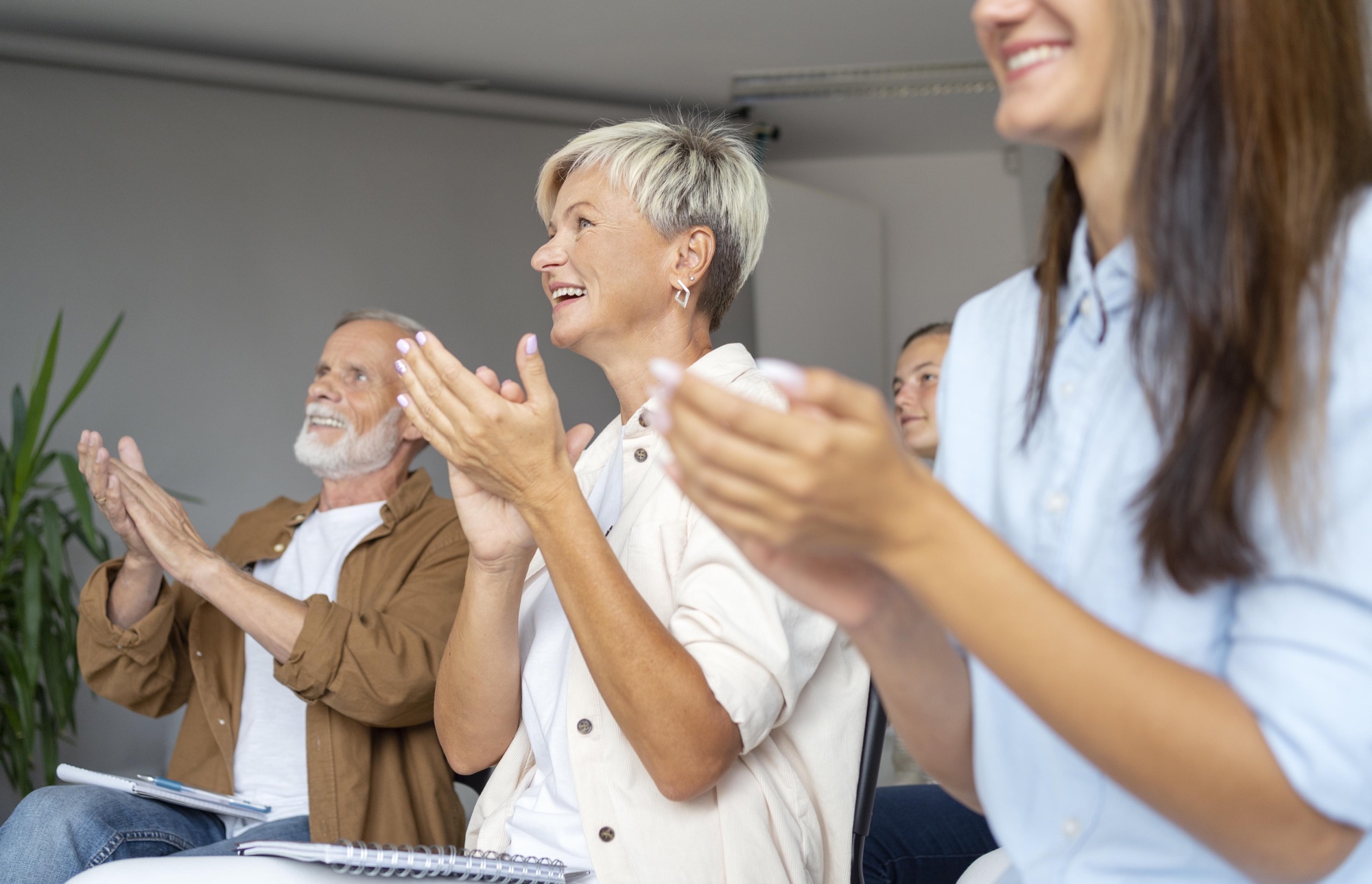 Audience applauding at a speaking engagement